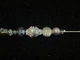 Silver tone crystal hat pin. 6"