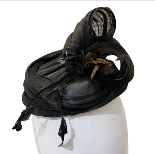 Elegant black fascinator with a leather crown