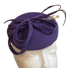 Purple lined felt cocktail hat. One size fits all .