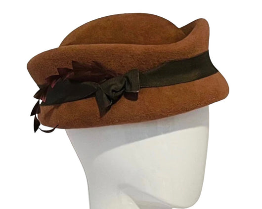 Old Chicago brick ' Revere' hat with ribbon and feather.