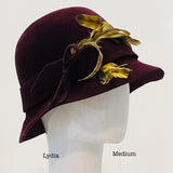 Burgundy Cloche with a yellow feather bouquet - Medium
