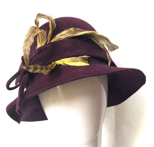 Burgundy Cloche with a yellow feather bouquet - Medium.