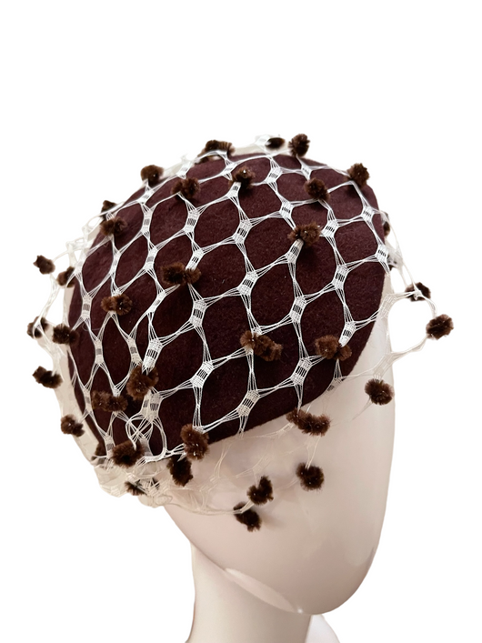 Brown cocktail hat with dotted netting